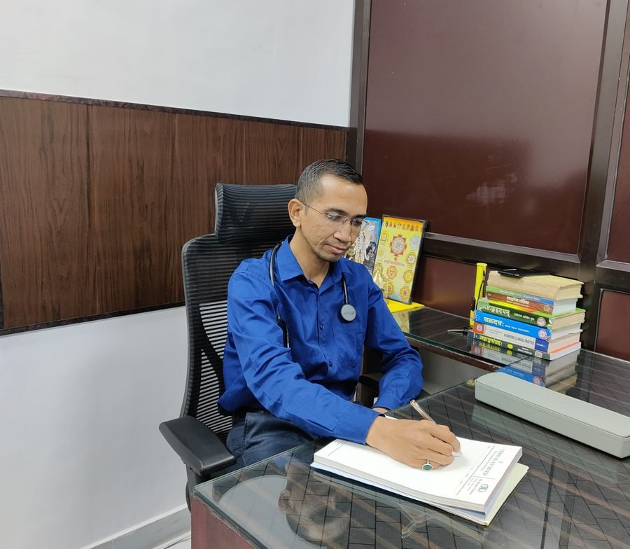 Prof. Dr. Hitendra Chiranji Mankele at his clinic desk